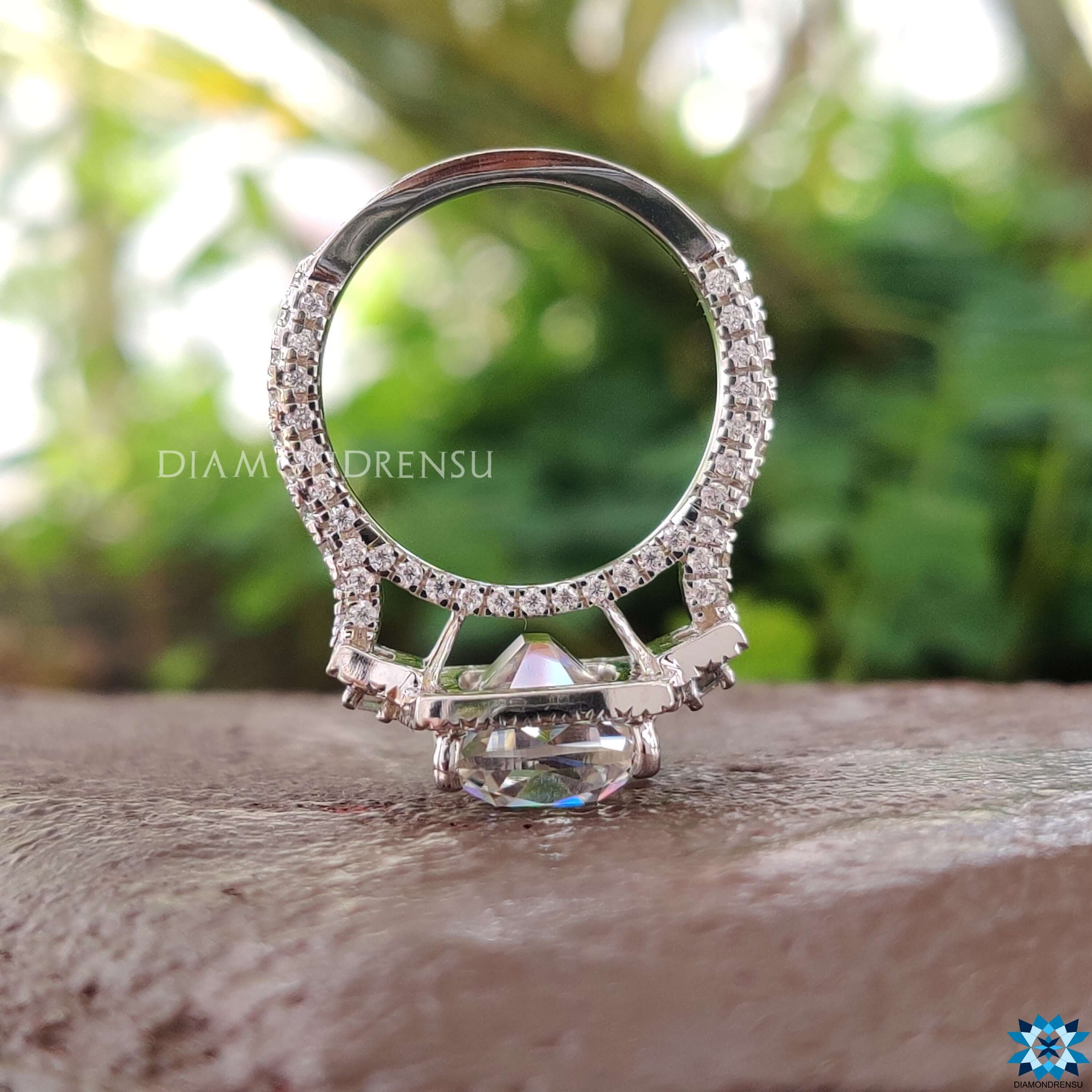 Elongated cushion moissanite ring with baguette side stones.