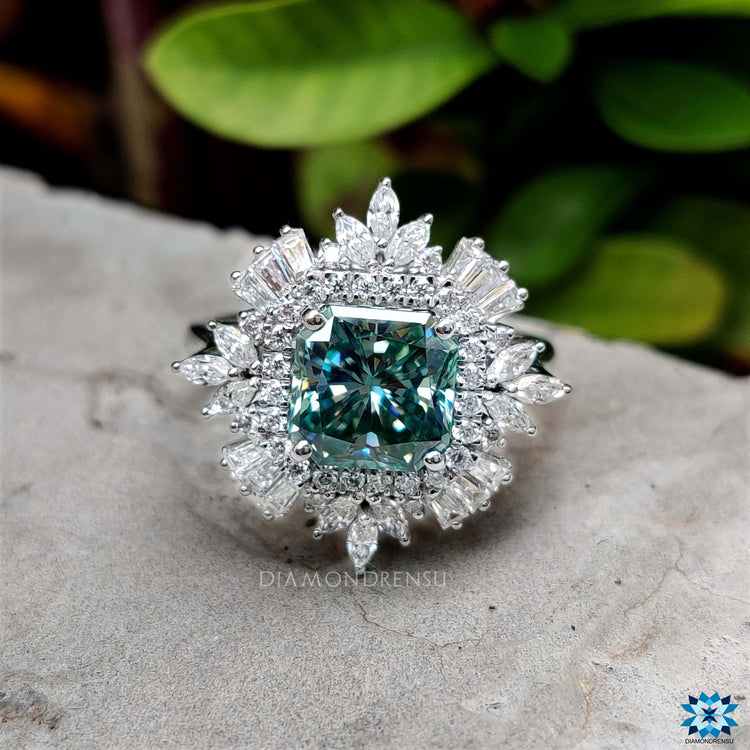 Handmade halo engagement ring with blue moissanite center.