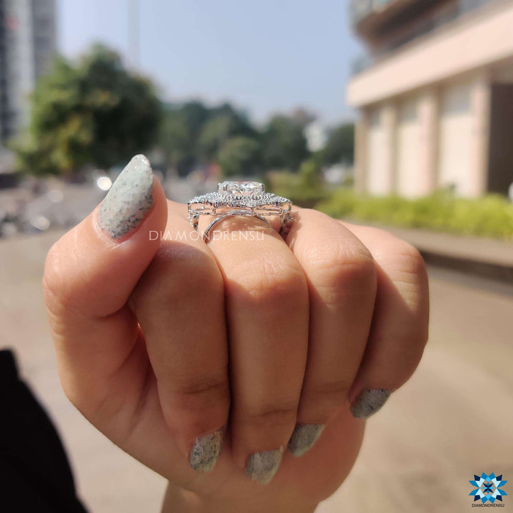 Vintage moissanite engagement ring with milgrain detailing.