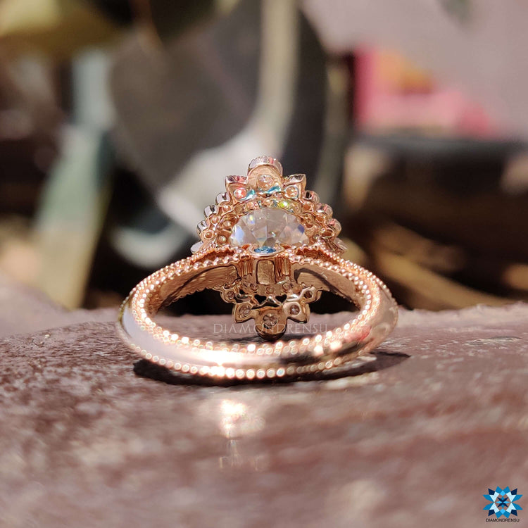 Rose gold vintage style moissanite engagement ring.