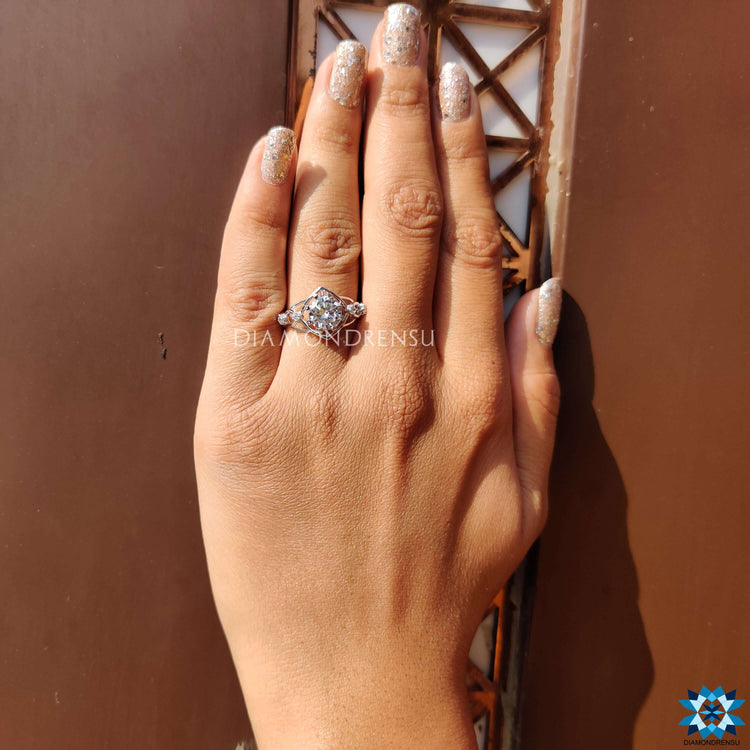 White gold ring with heart prong setting and round moissanite.