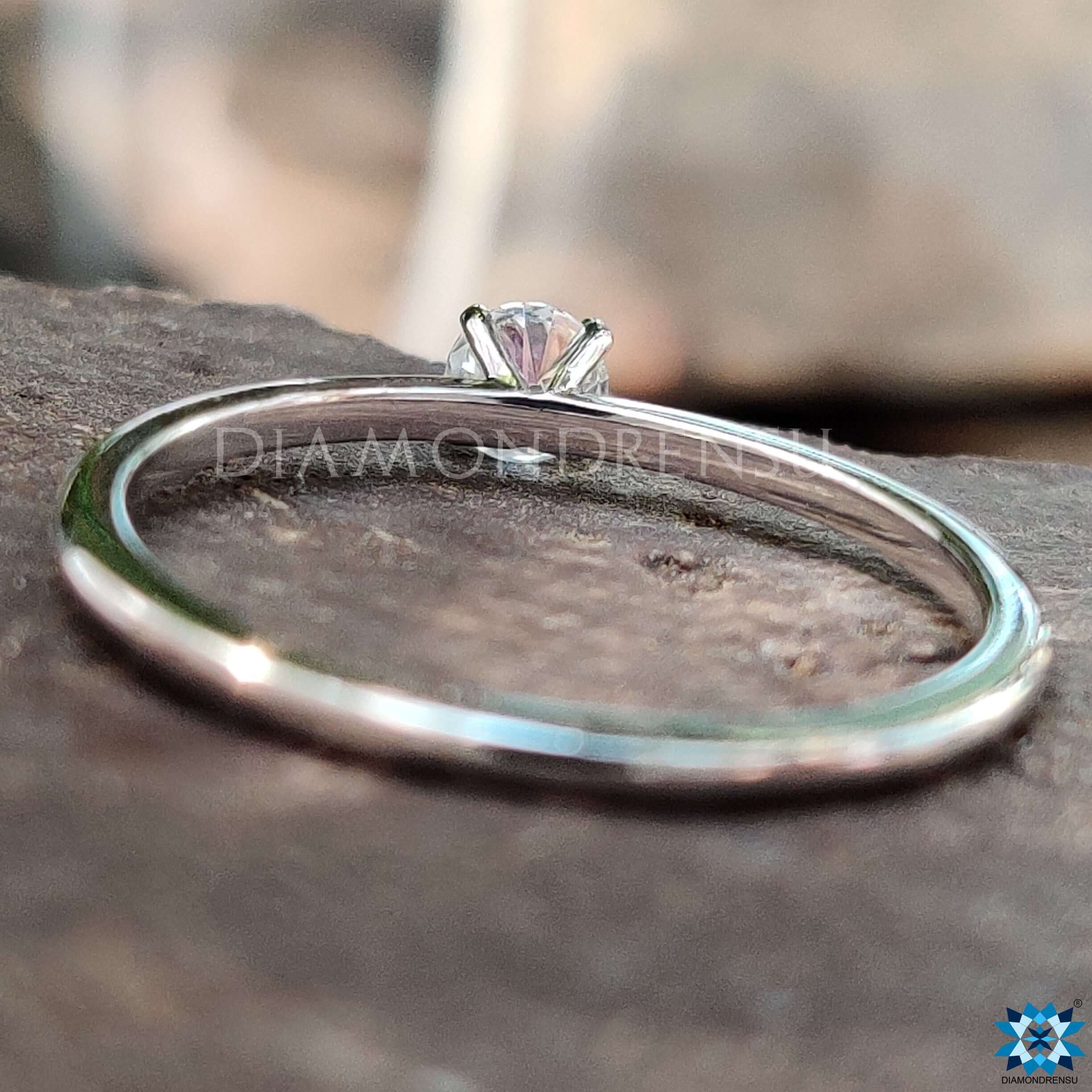 White gold round solitaire engagement ring.