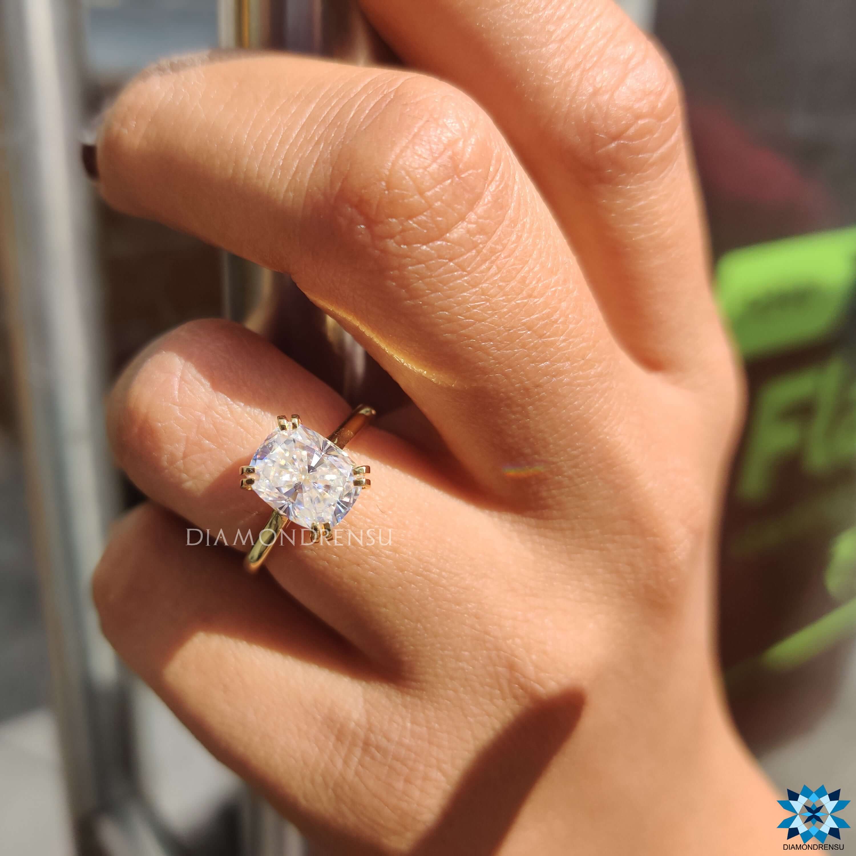 Yellow gold moissanite engagement ring.