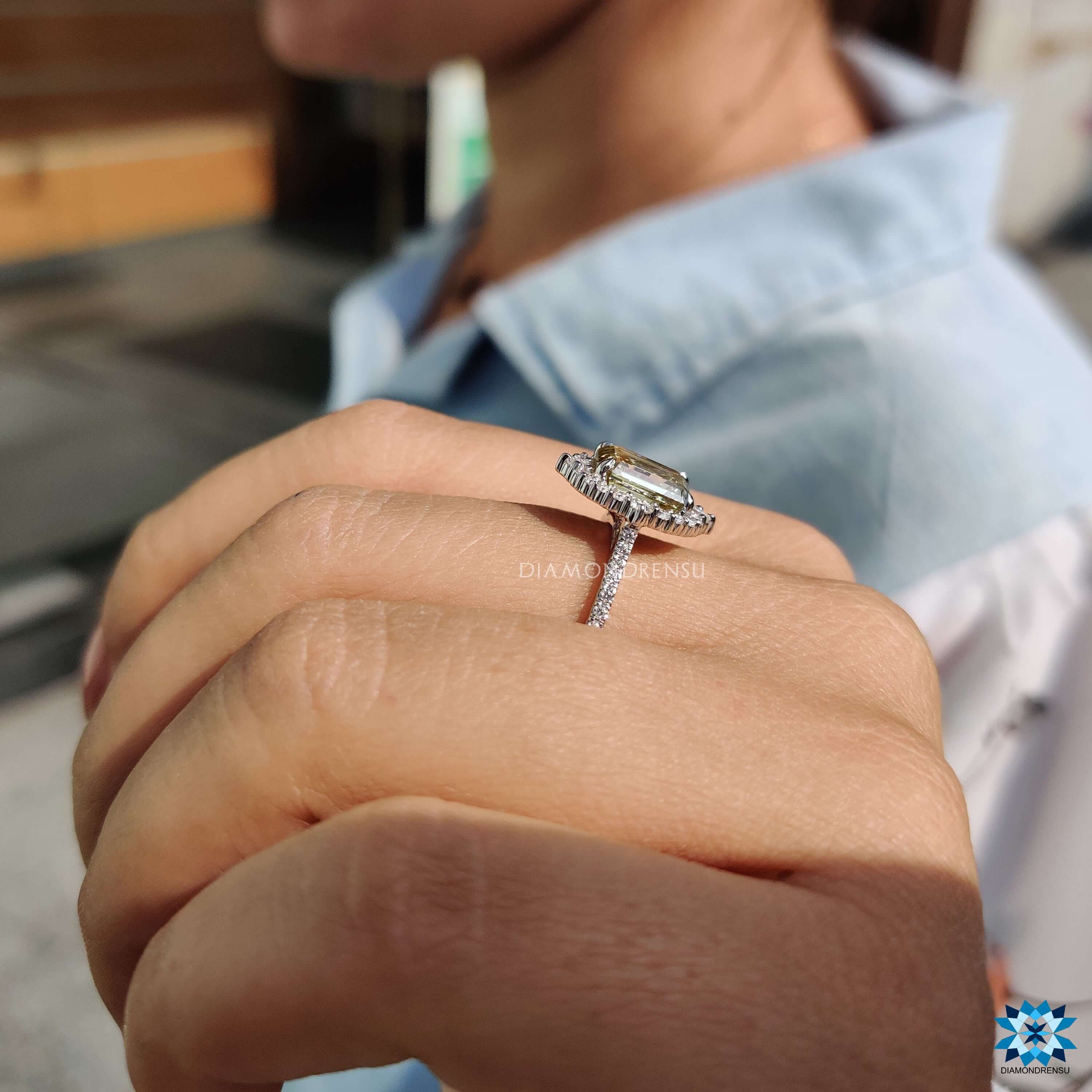 Custom engagement ring with pave band and moissanite center.