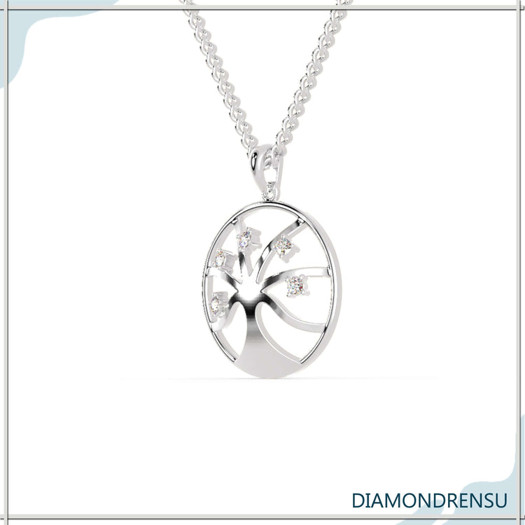 White gold pendant with delicate tree of life engraving.