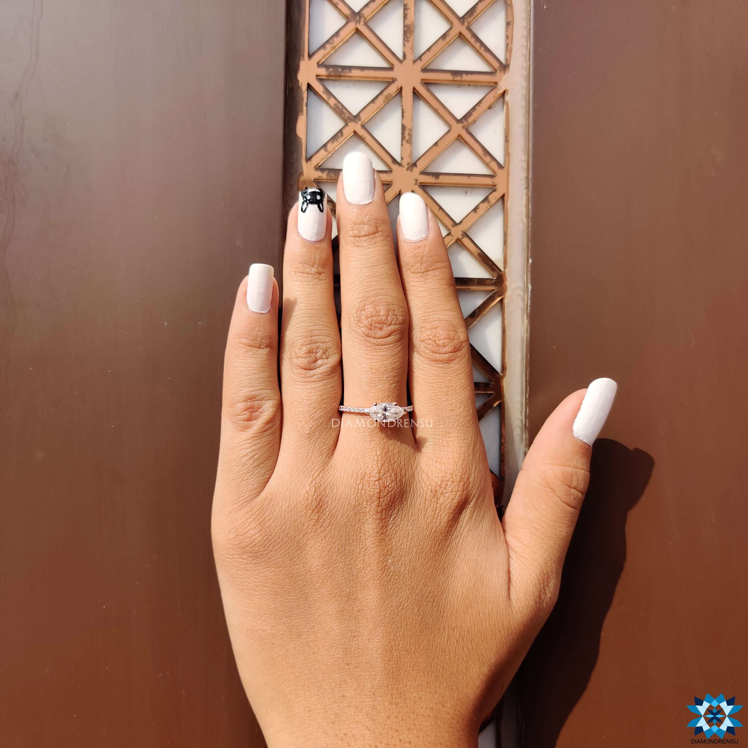 V and round prong setting moissanite ring.