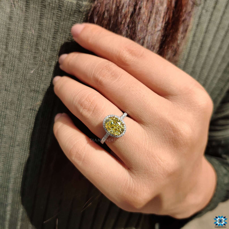 Two tone yellow and white gold oval ring with pave band.