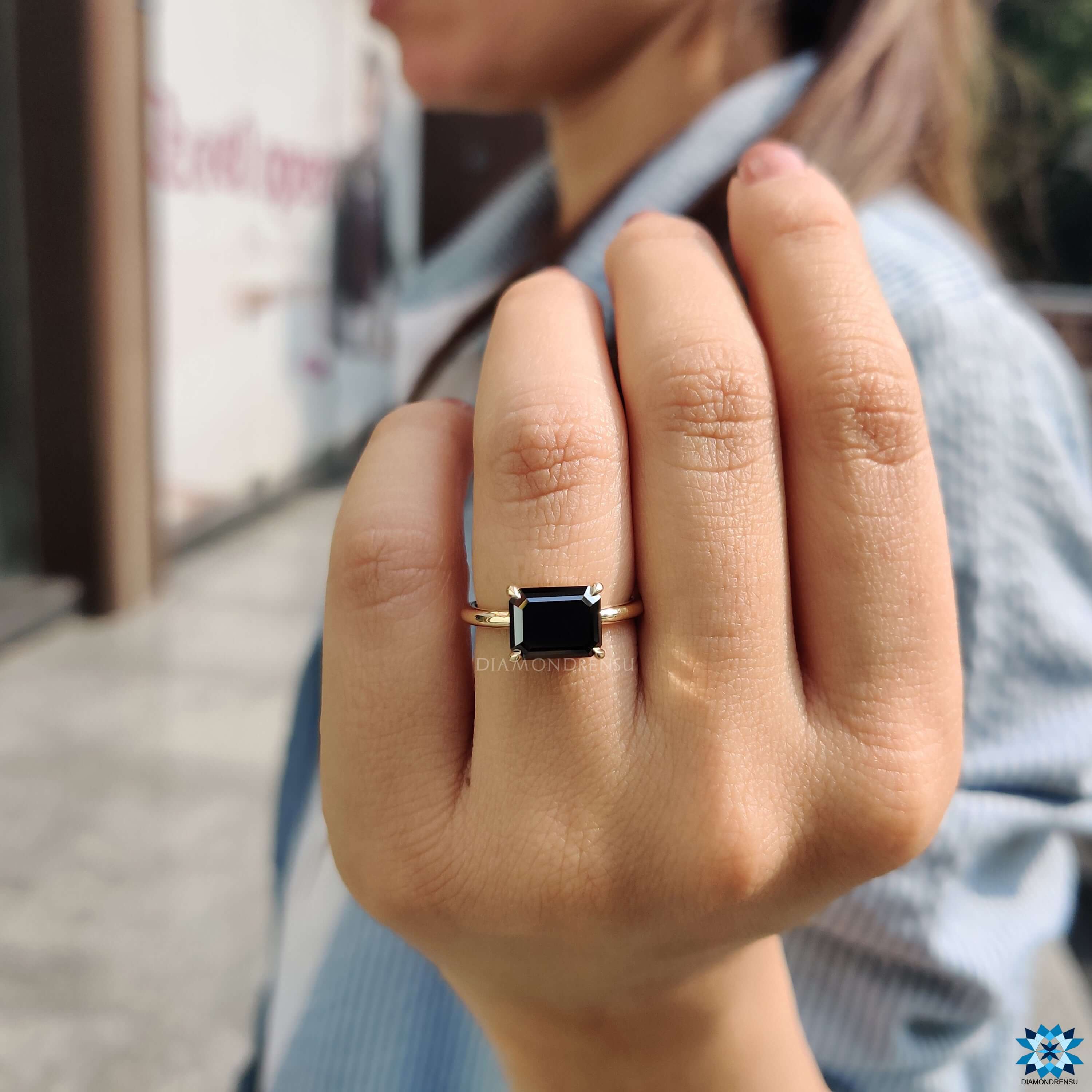 Emerald cut moissanite ring.