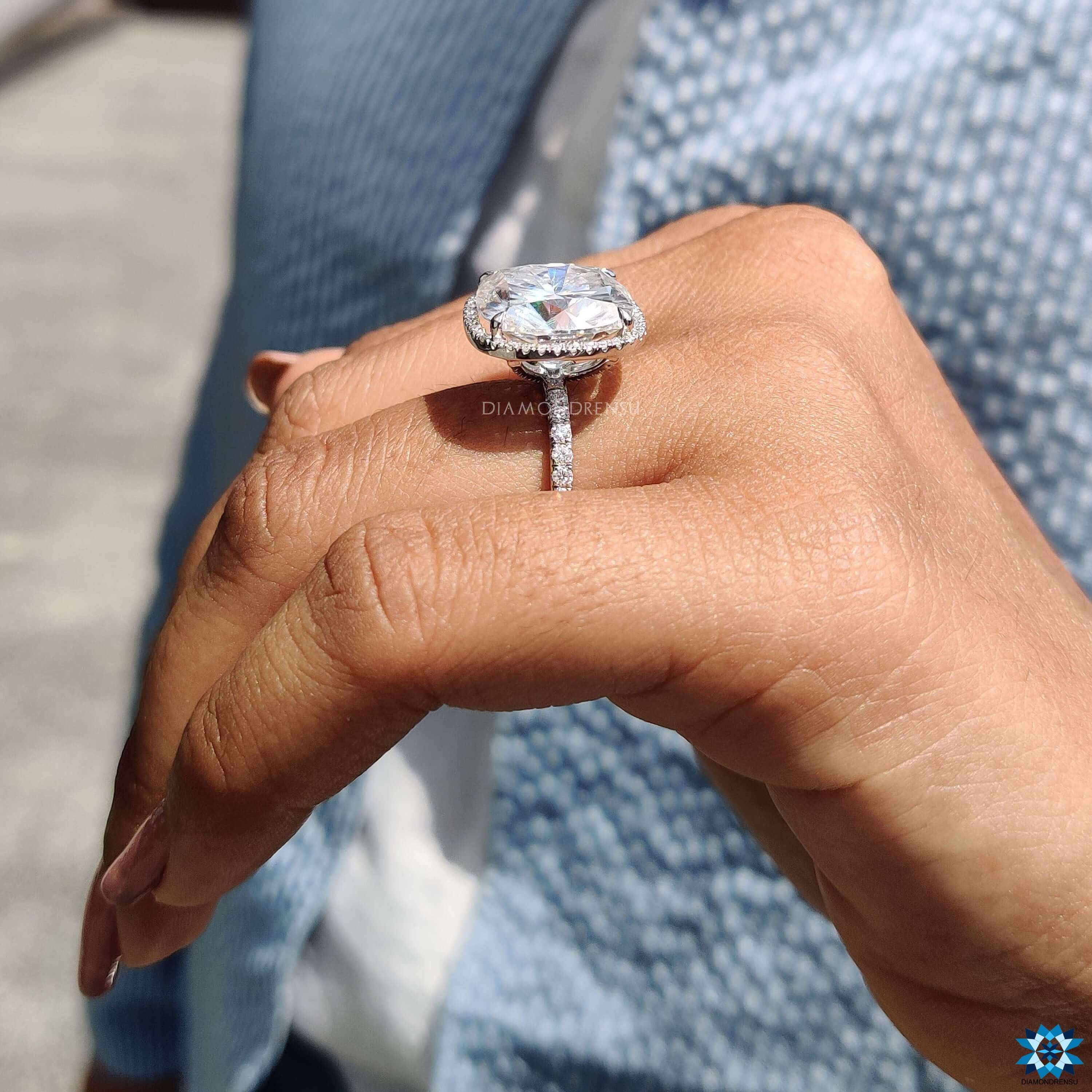 Handmade ring with moissanite cushion center and halo.