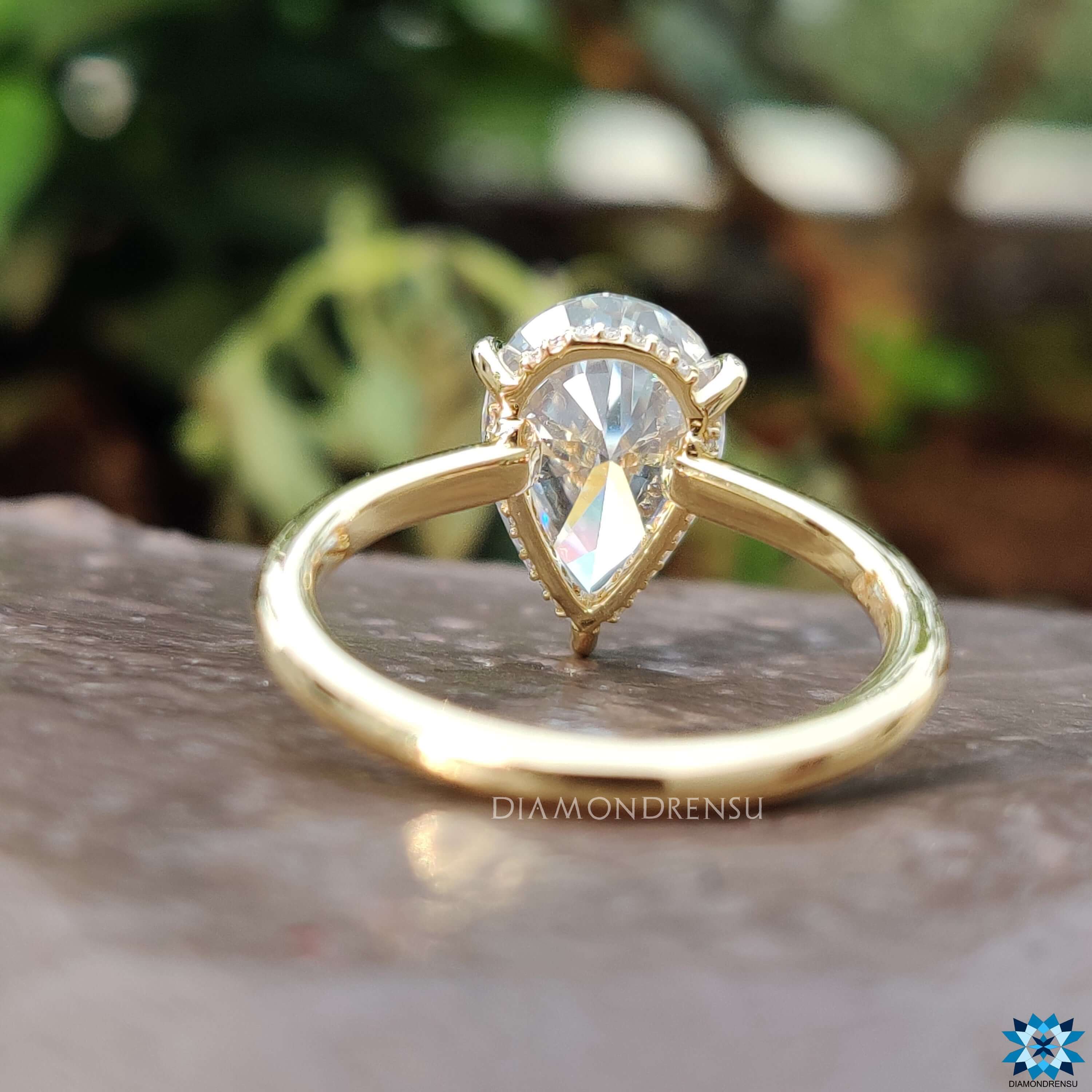 Moissanite ring featuring hidden halo and 3 claw prong setting.