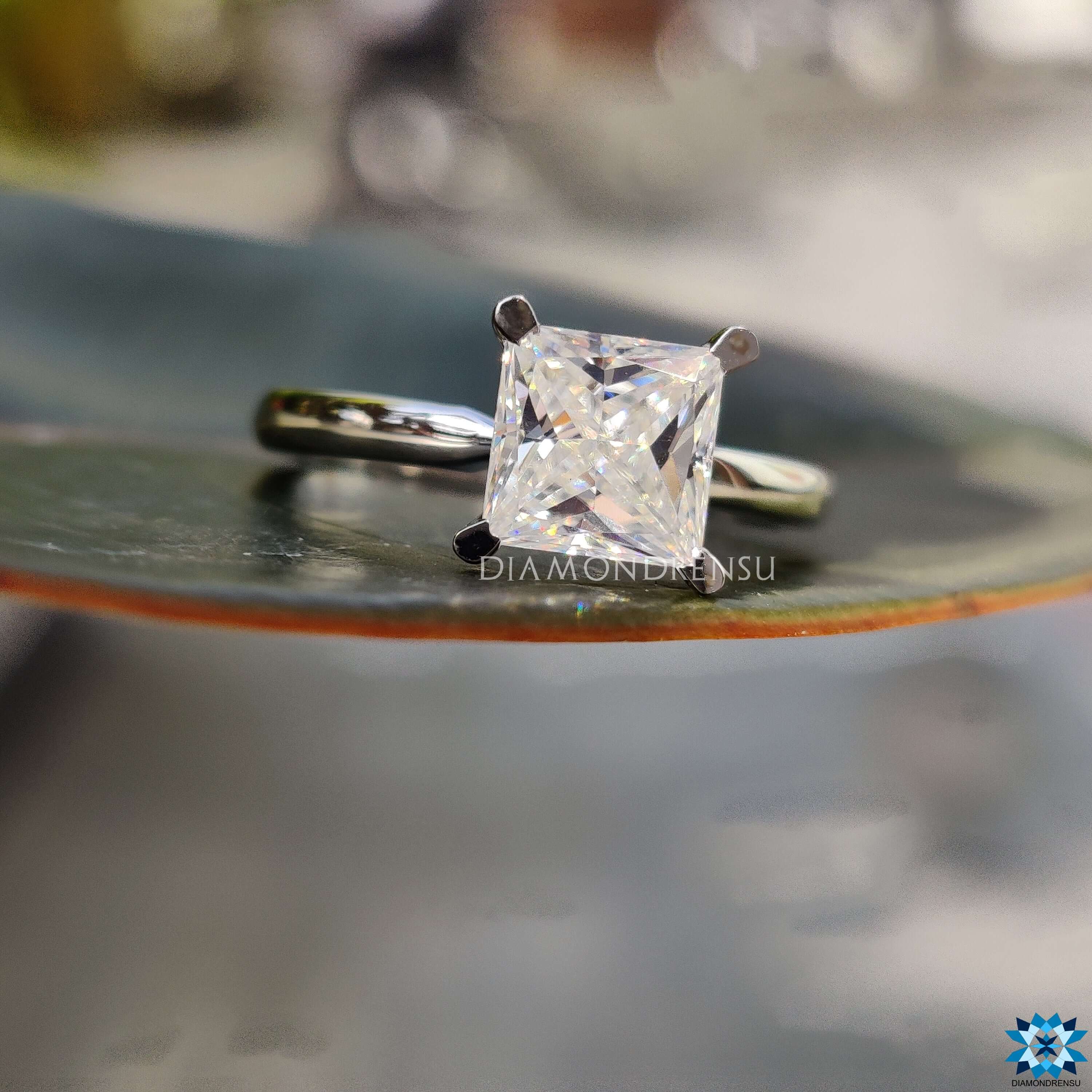 Handmade princess solitaire moissanite ring.