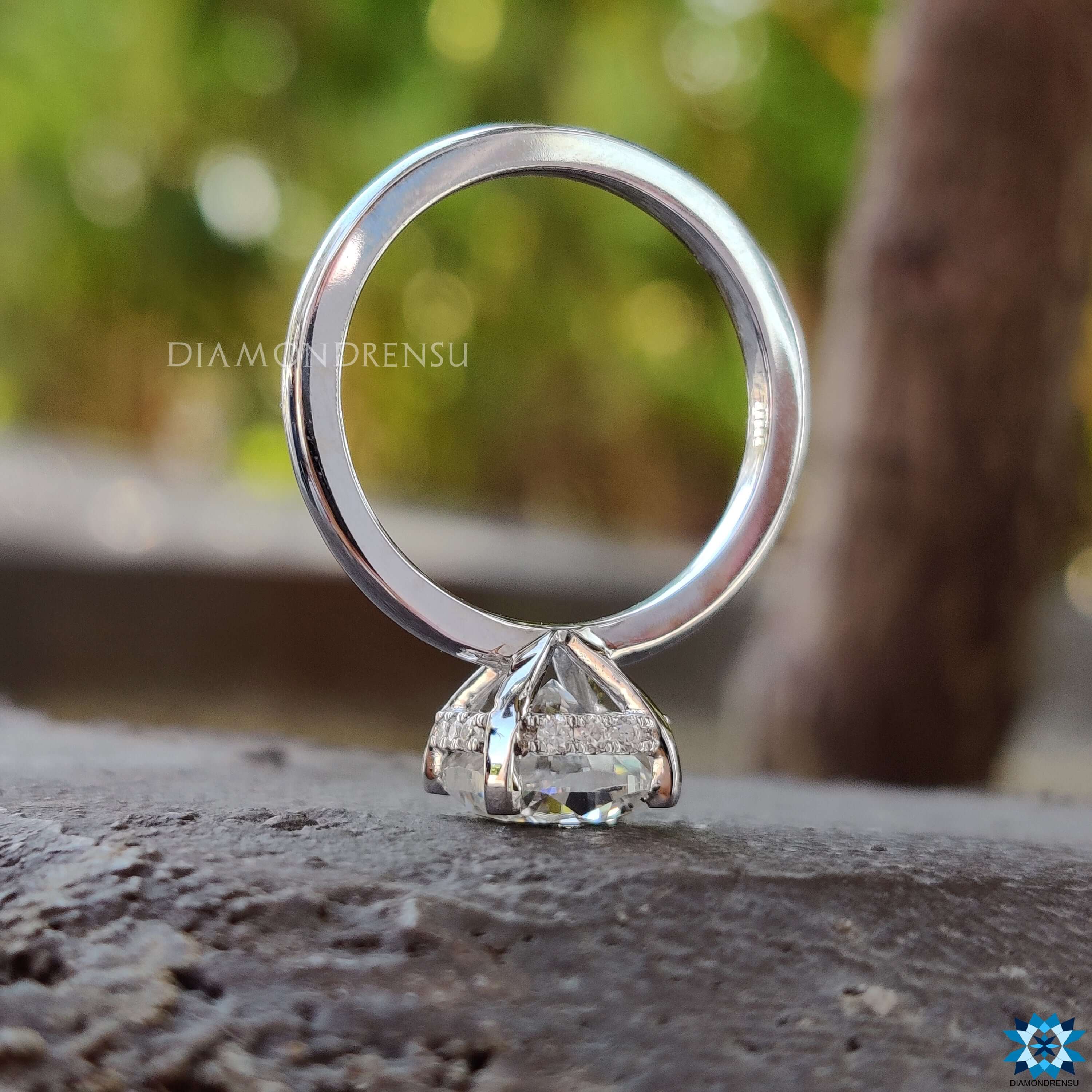 Prong set moissanite ring with cushion cut center.