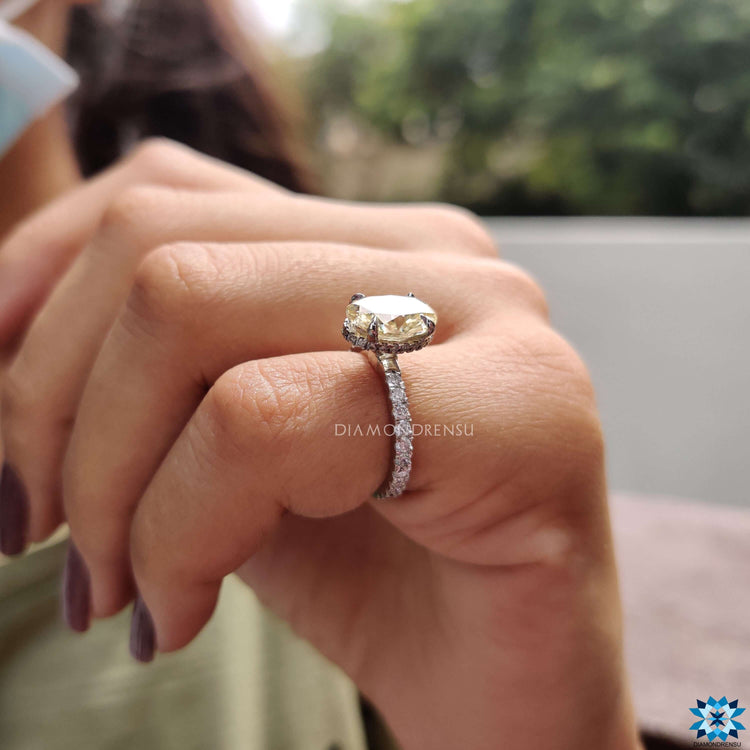 Elegant hidden halo ring with prong set moissanite.