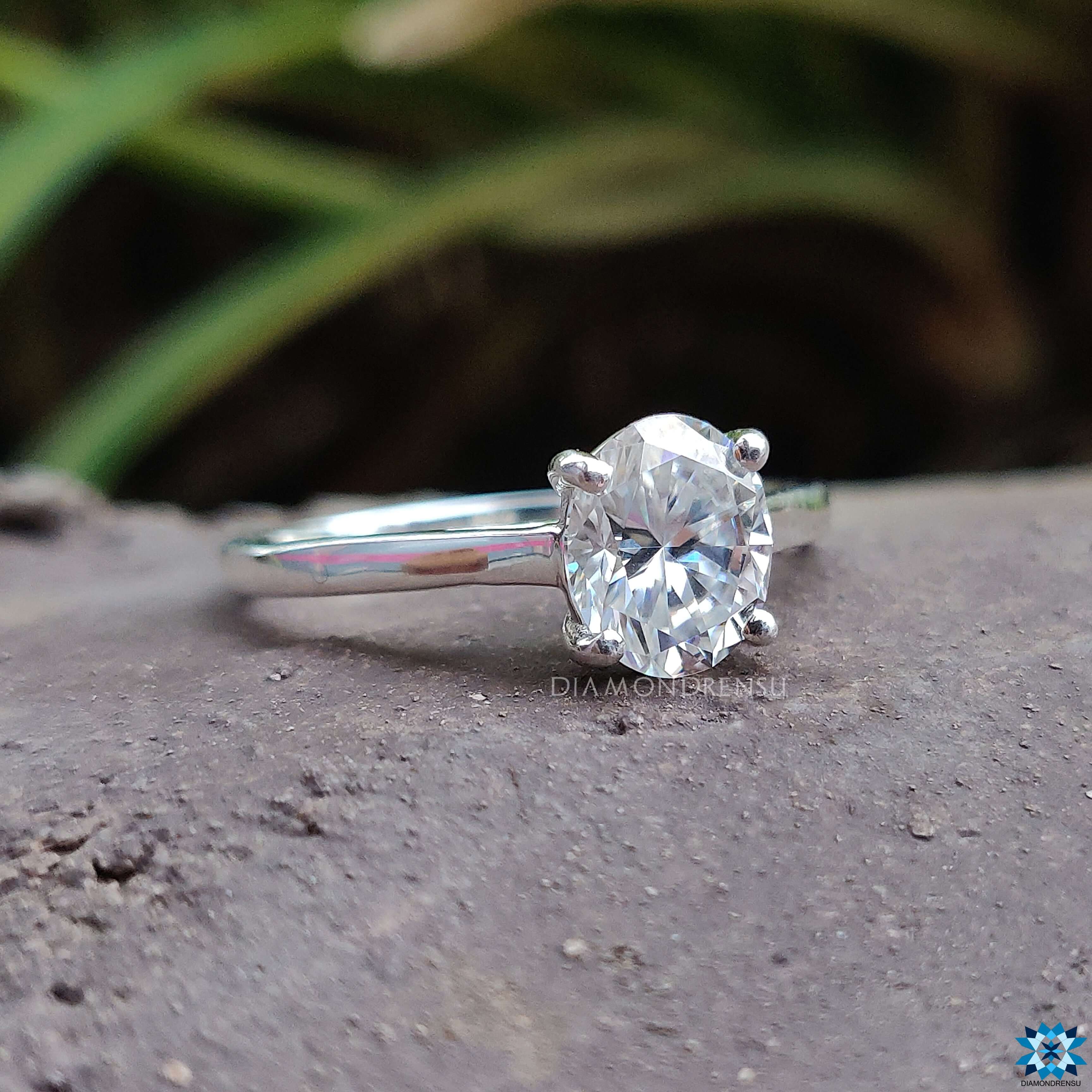 wedding Oval solitaire engagement ring with a 4 round prong set in white gold.