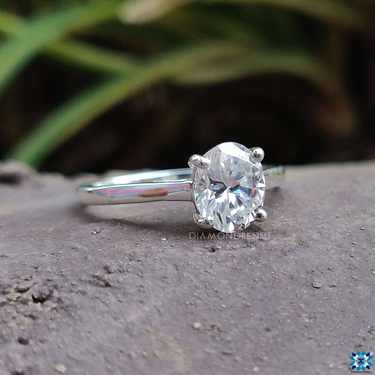 wedding Oval solitaire engagement ring with a 4 round prong set in white gold.
