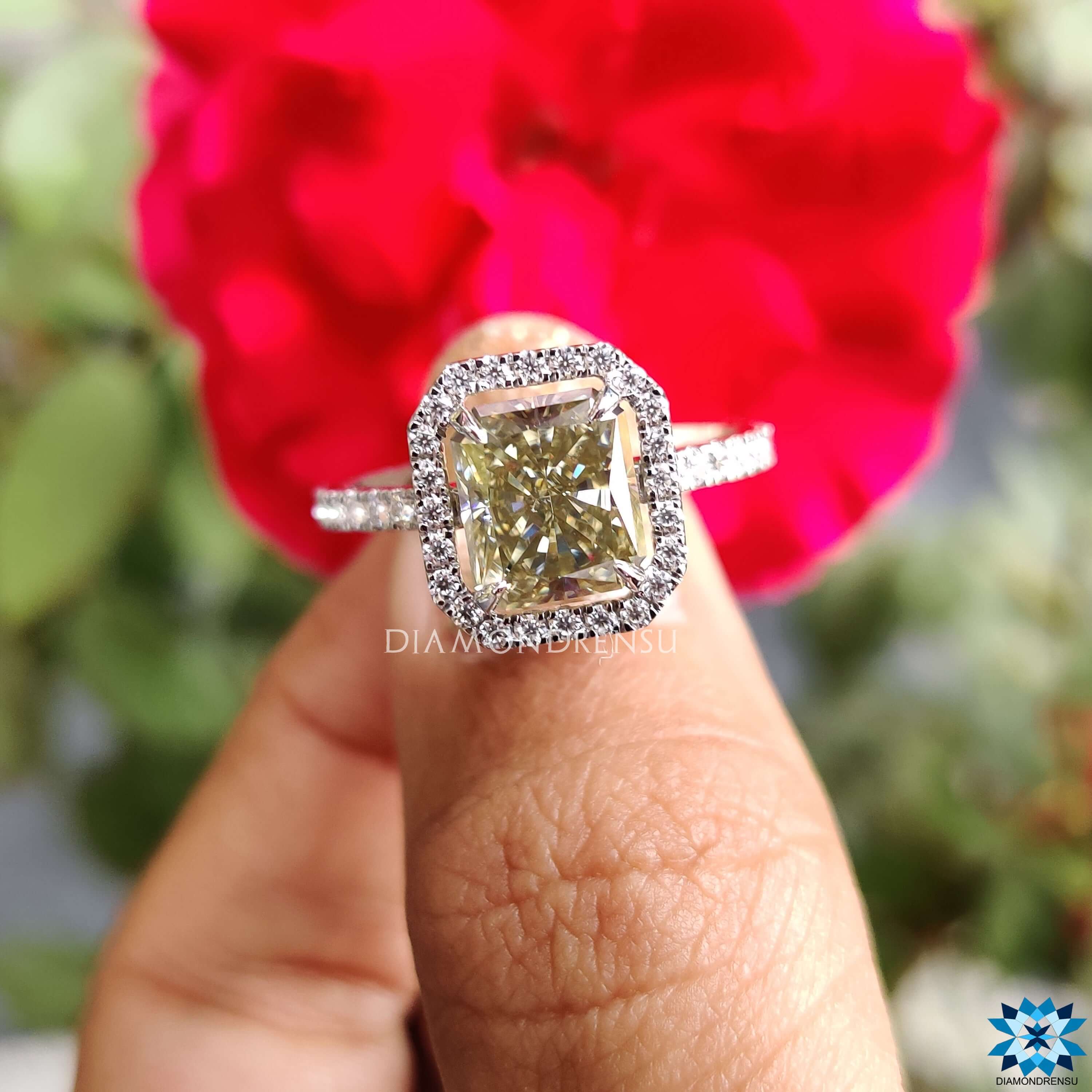 Custom engagement ring featuring hidden halo and radiant moissanite.