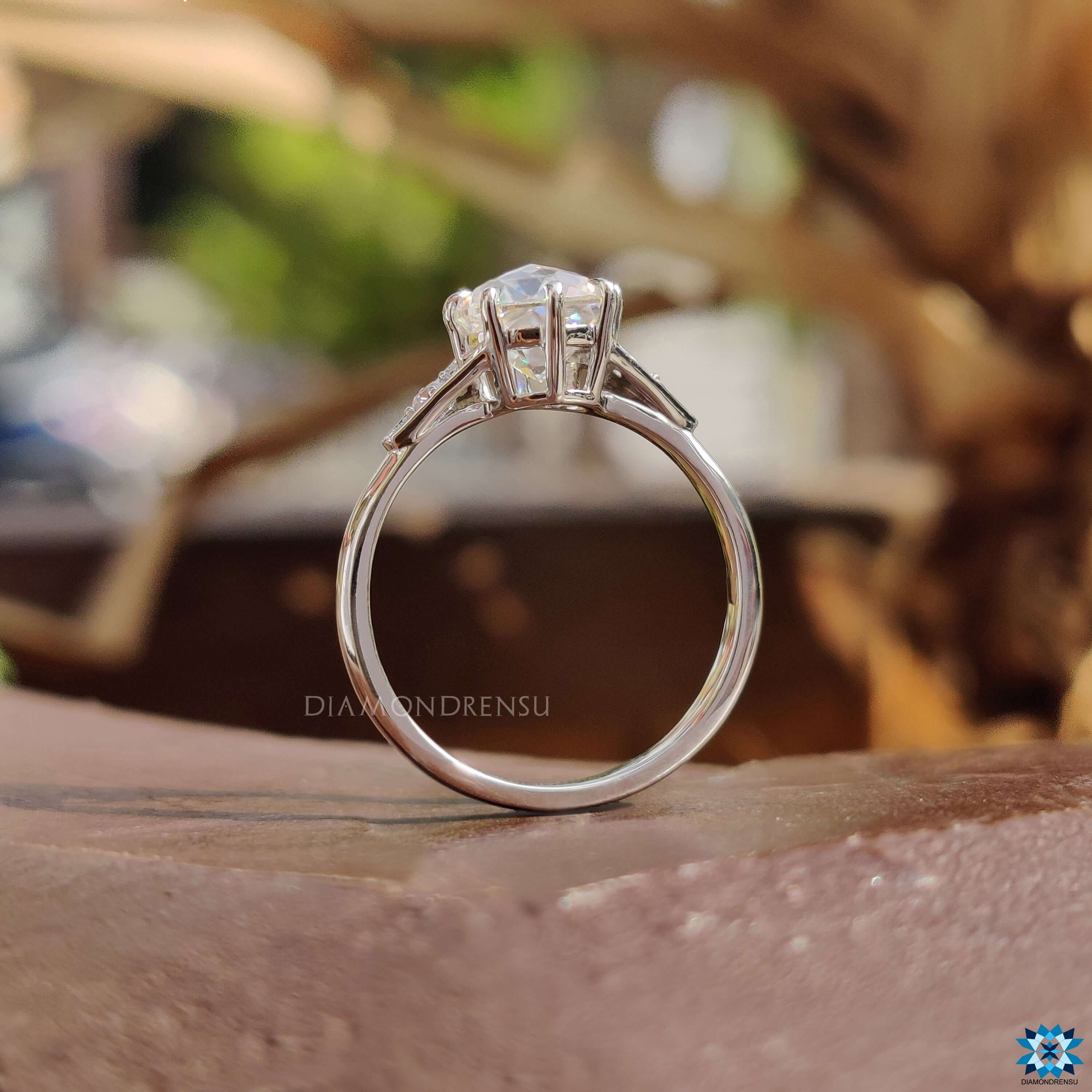 White gold moissanite ring.
