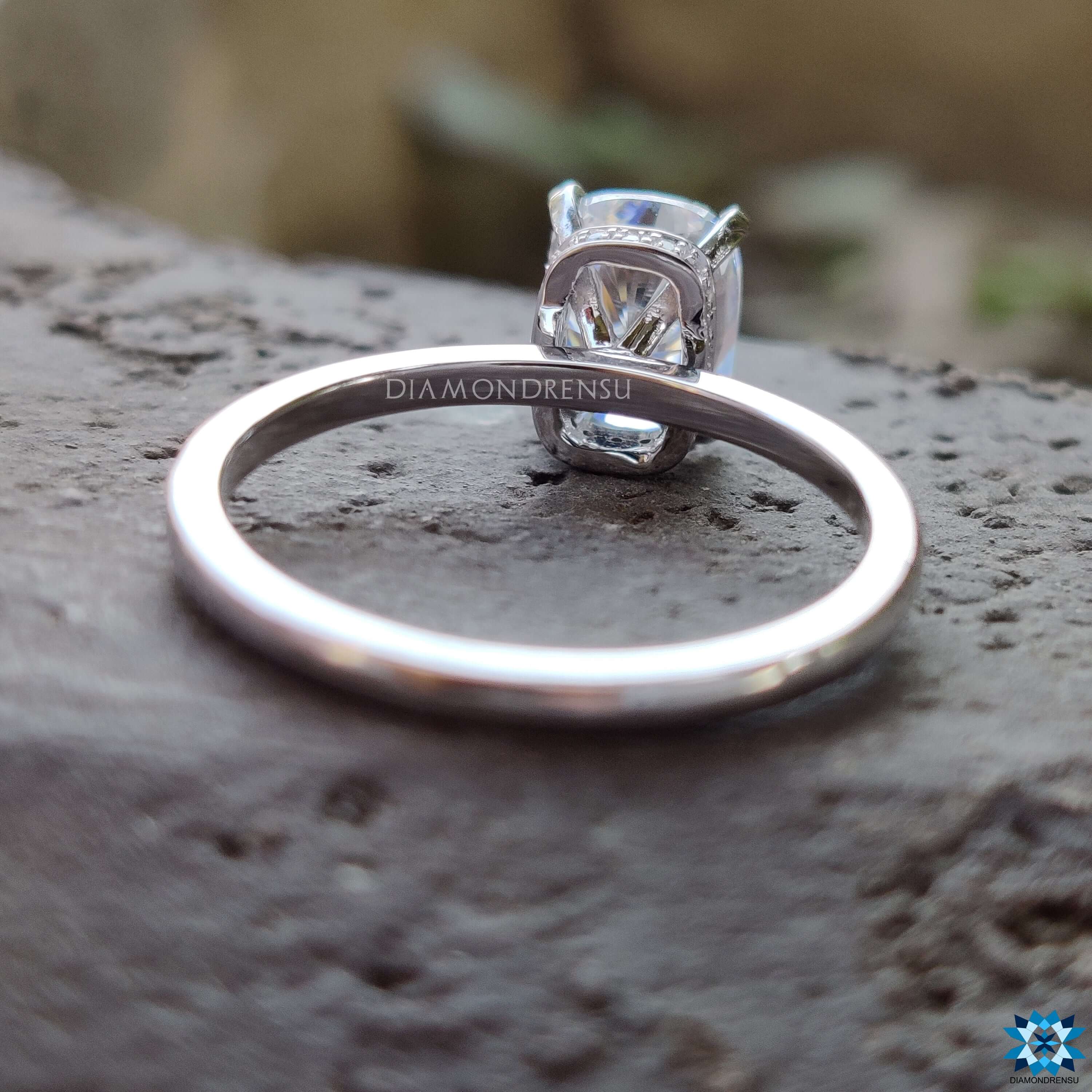 Handmade white gold ring with hidden halo design.