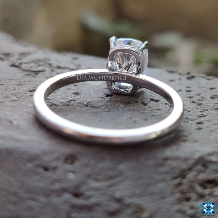 Handmade white gold ring with hidden halo design.