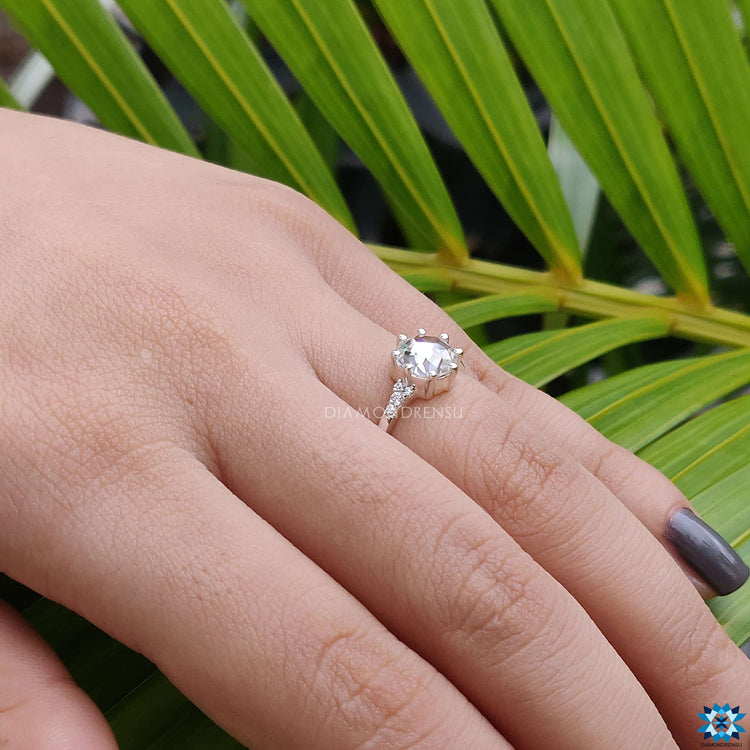 Round rose cut Moissanite ring with prong setting and Muse-inspired silhouette.