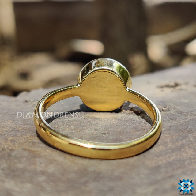 Moissanite for engagement ring in bezel setting and rose cut shape.