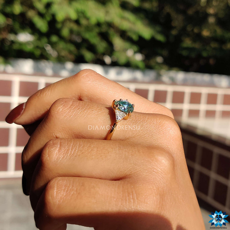 Diamondrensu UK pear and triangle cut moissanite ring.