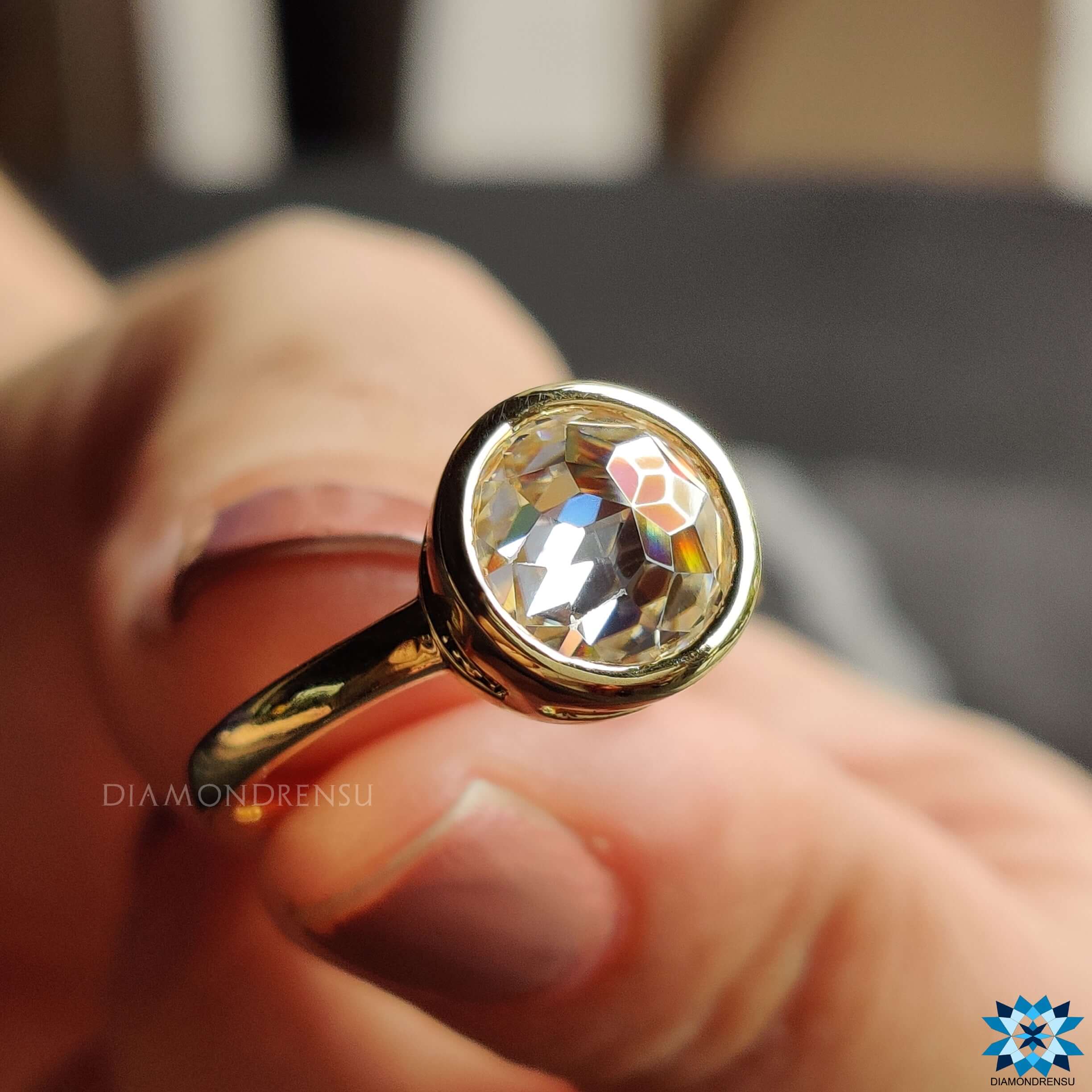 Classic bezel set moissanite ring with a secure and stylish design.