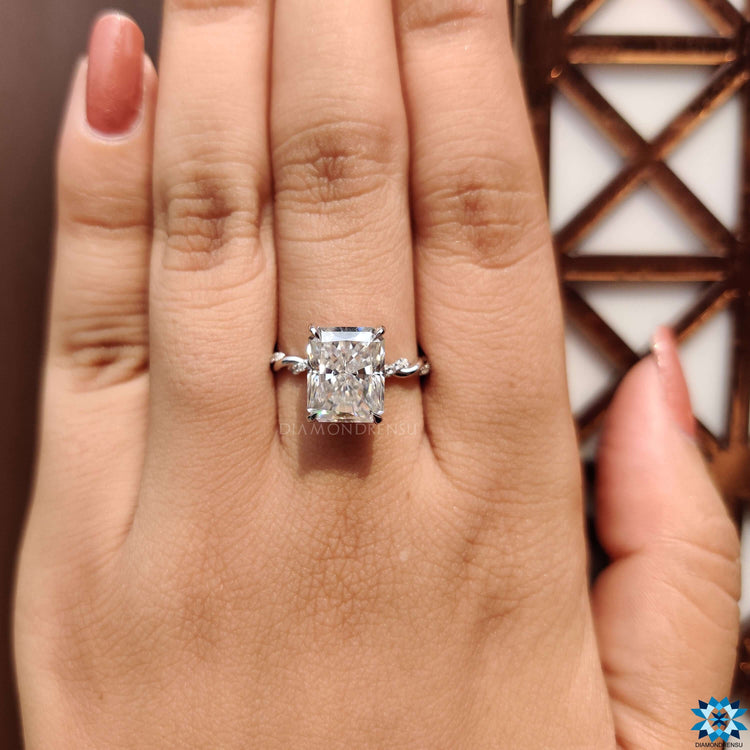Moissanite ring with twisted band design.