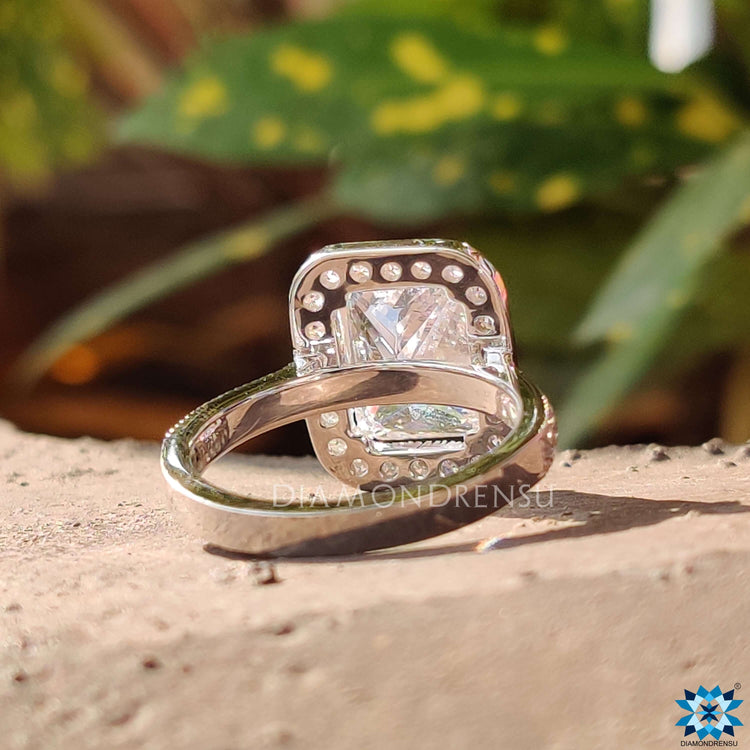 Halo ring featuring radiant cut moissanite.