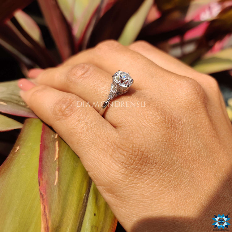 Claw prong ring setting in vintage gold engagement ring for secure hold.