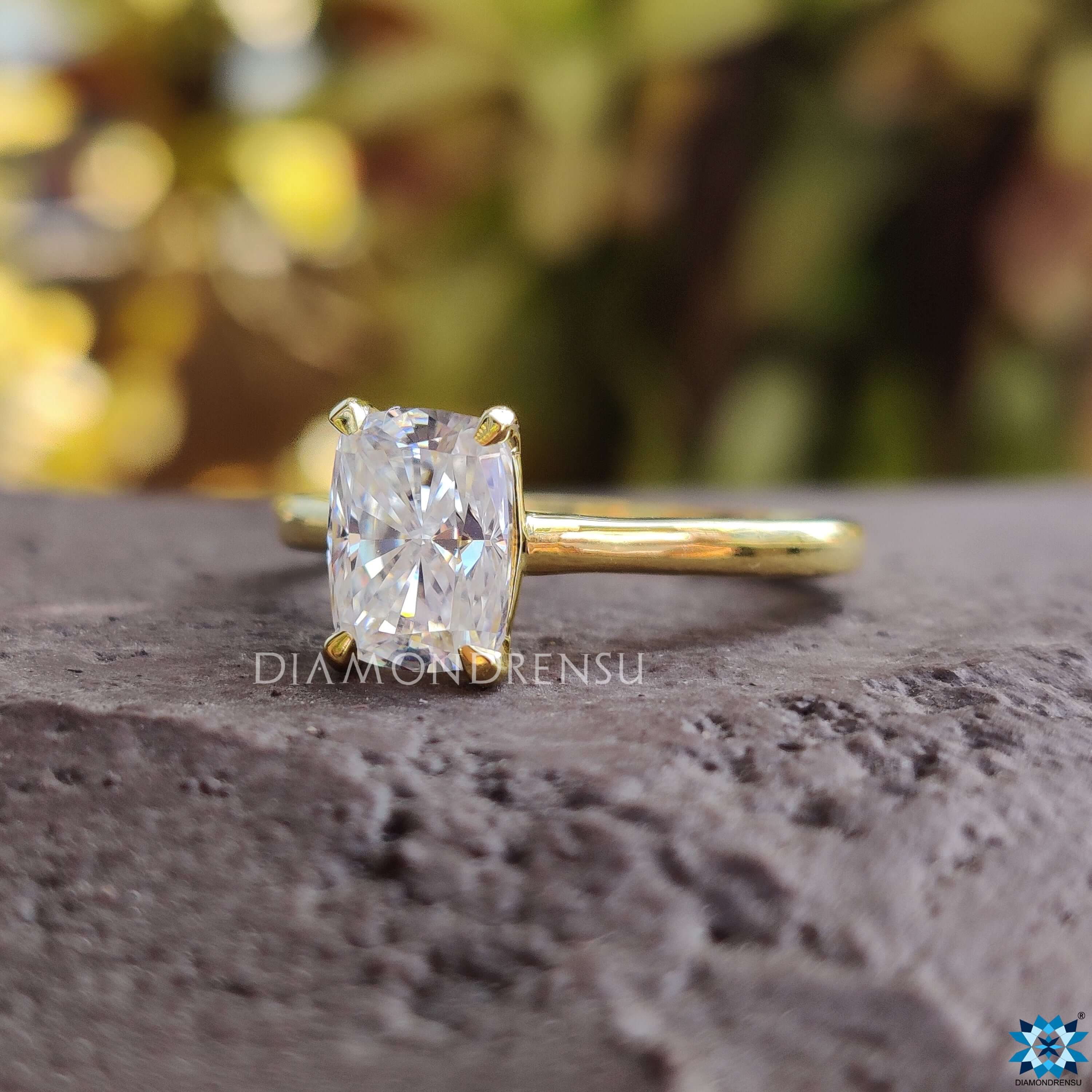 Custom engagement ring with a 4 prong setting and soft yellow gold finish.