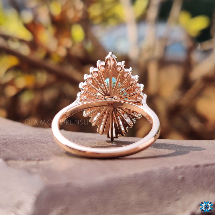 Rose gold moissanite ring with prong setting.