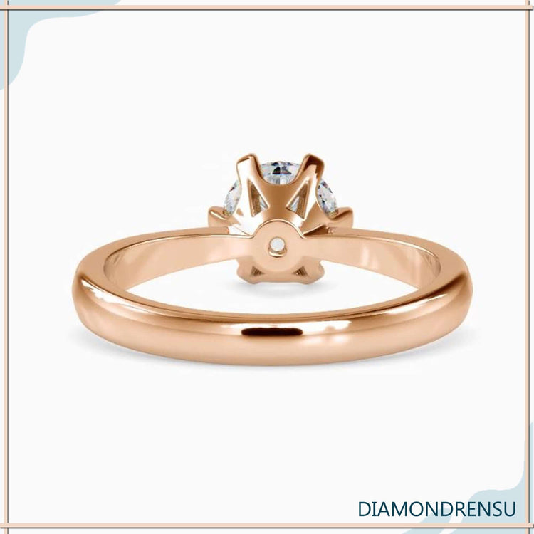 Handmade ring with round lab diamond and tapered shank.