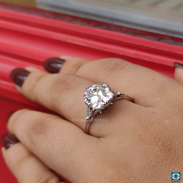 Cushion cut old European style ring with prong setting.