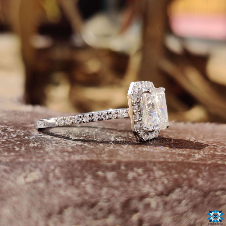 Round moissanite ring with pave setting.