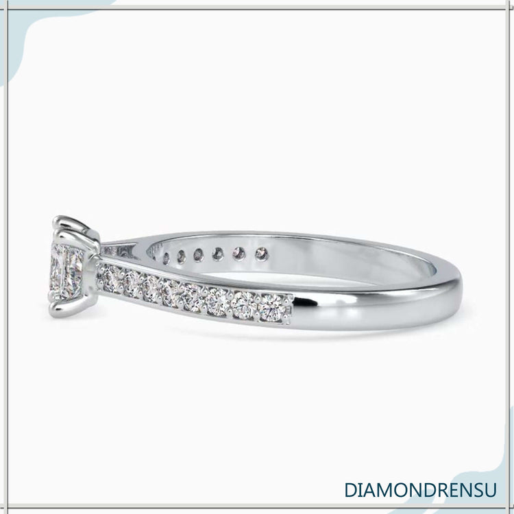 Yellow gold diamond ring with channel side detail.