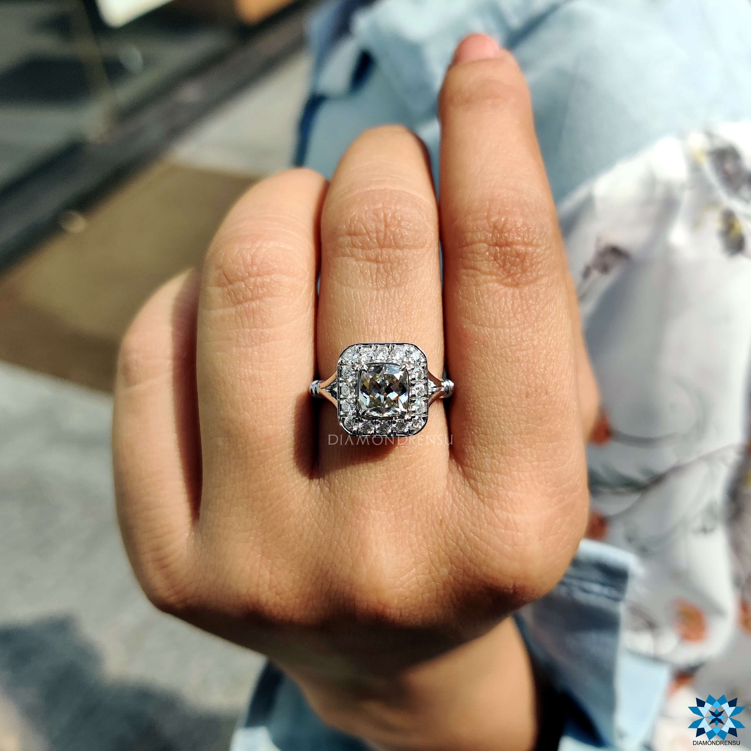 Cushion divine cut moissanite ring in white gold.