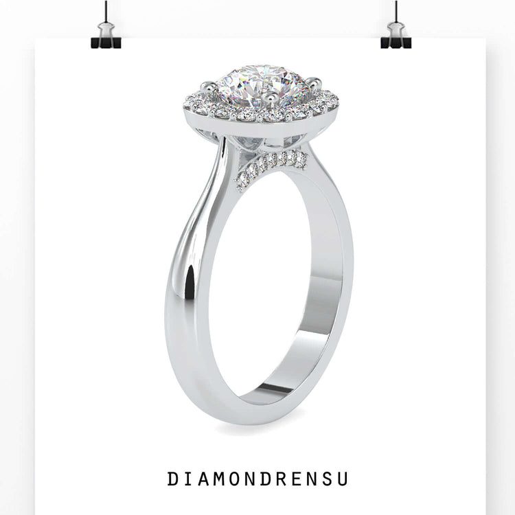 White gold diamond ring with pave halo and bridge accent.