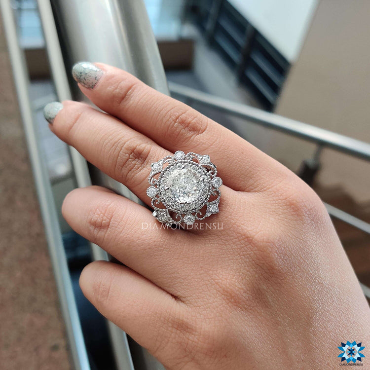 Custom white gold ring with antique-style design.