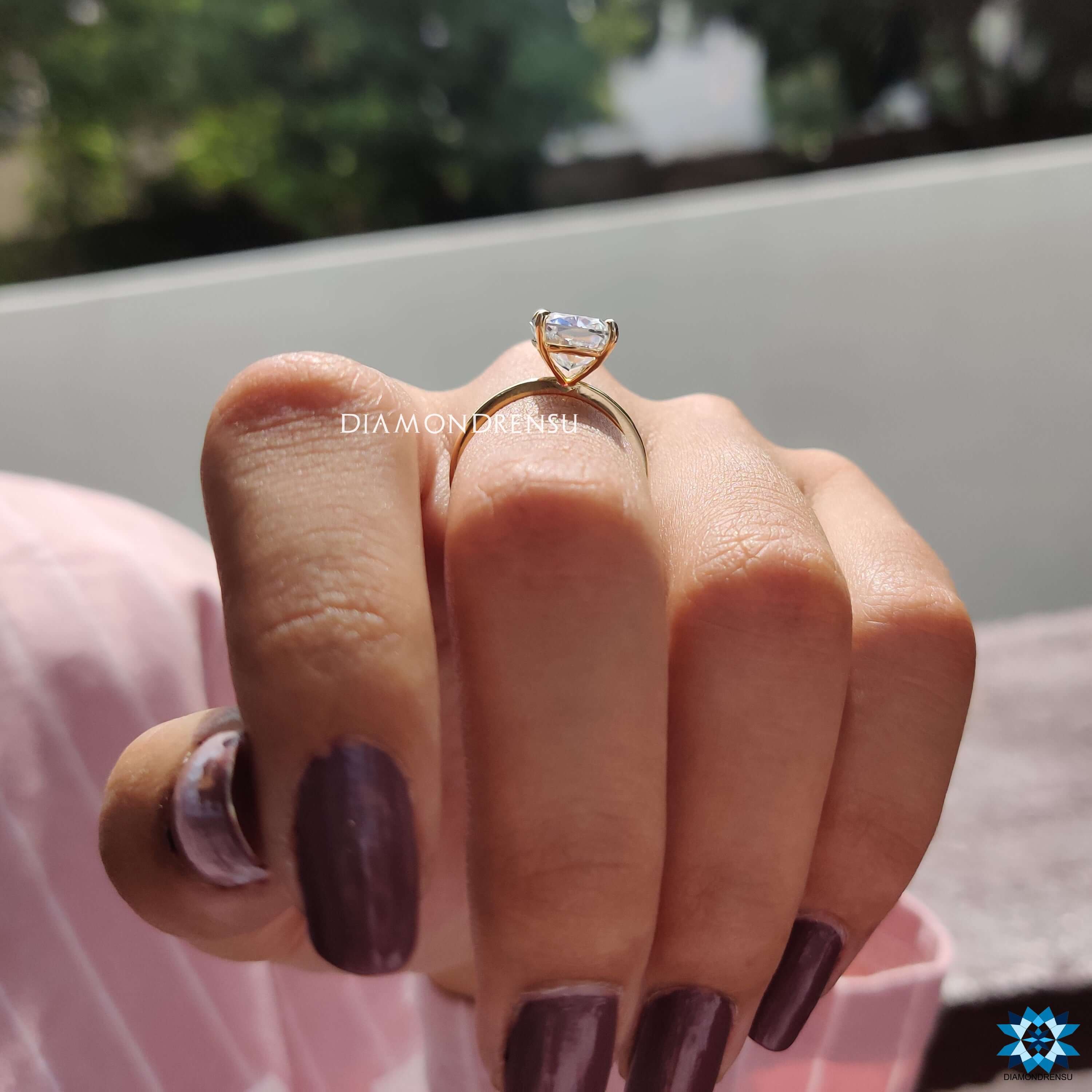 Buy moissanite ring with crushed ice cushion cut in yellow gold.