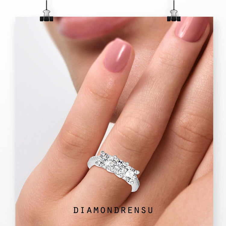Radiant cut diamond ring in a handmade white gold setting.