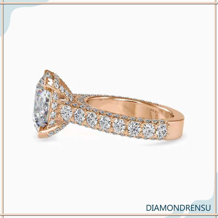 Custom engagement ring with bridge accent and pave rows.