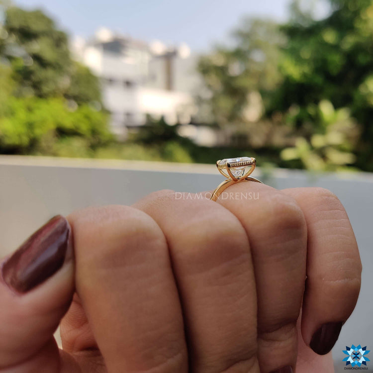 Buy moissanite princess cut engagement ring crafted in yellow gold.