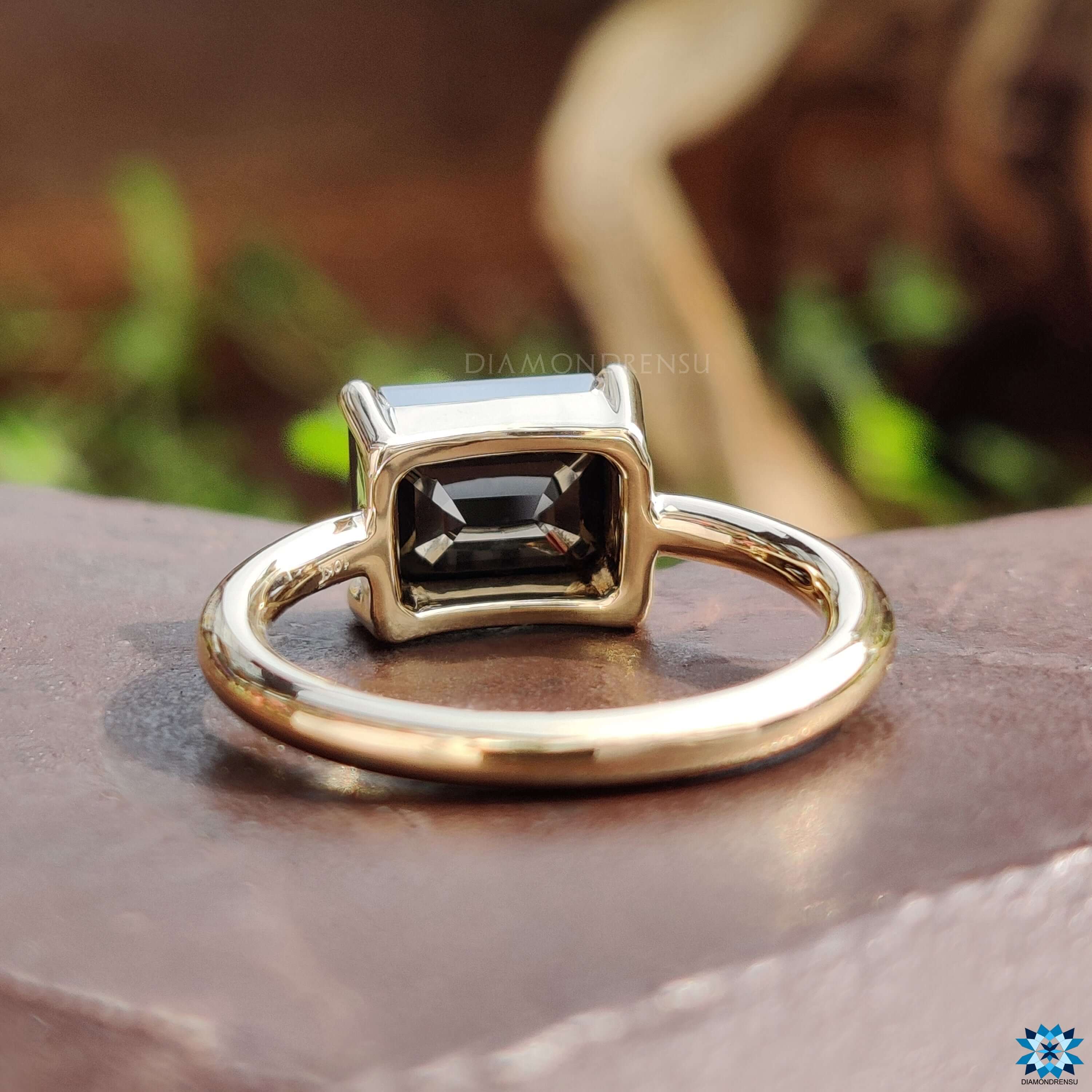 Yellow gold moissanite ring.