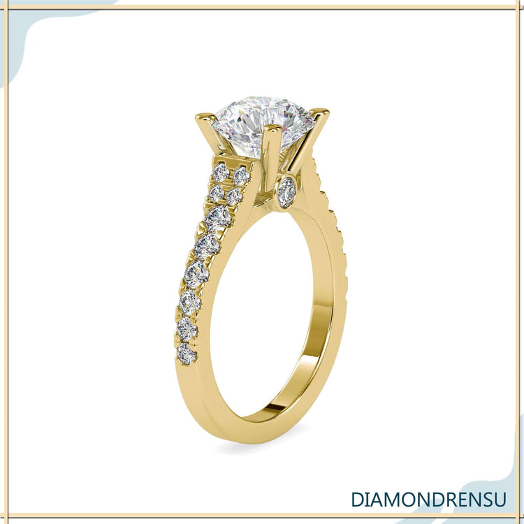 Diamondrensu UK ring with peekaboo diamond and pave setting.