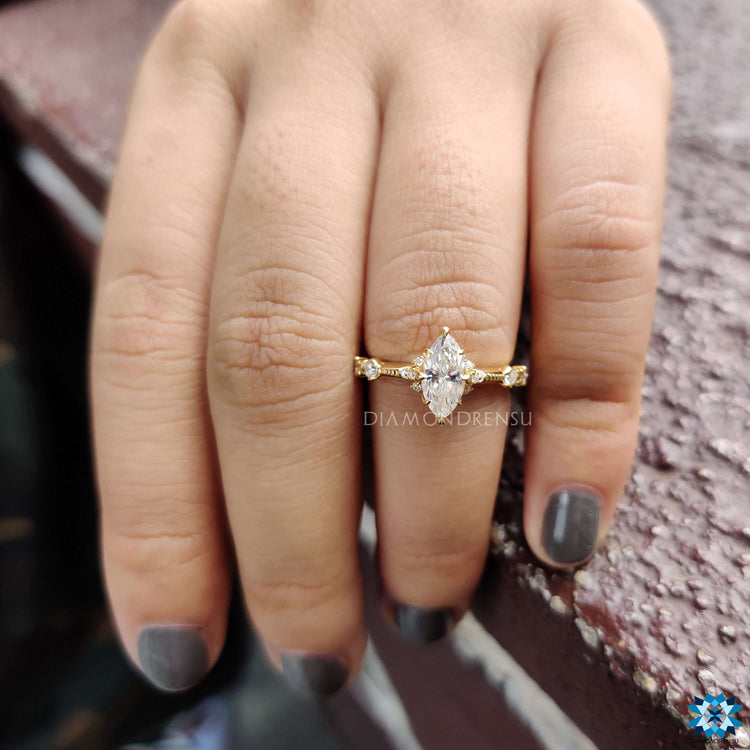 Yellow gold ring with marquise center and vintage milgrain.