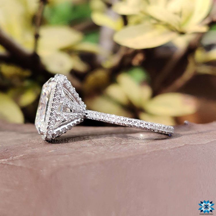 Three side pave set ring with cushion cut center stone.
