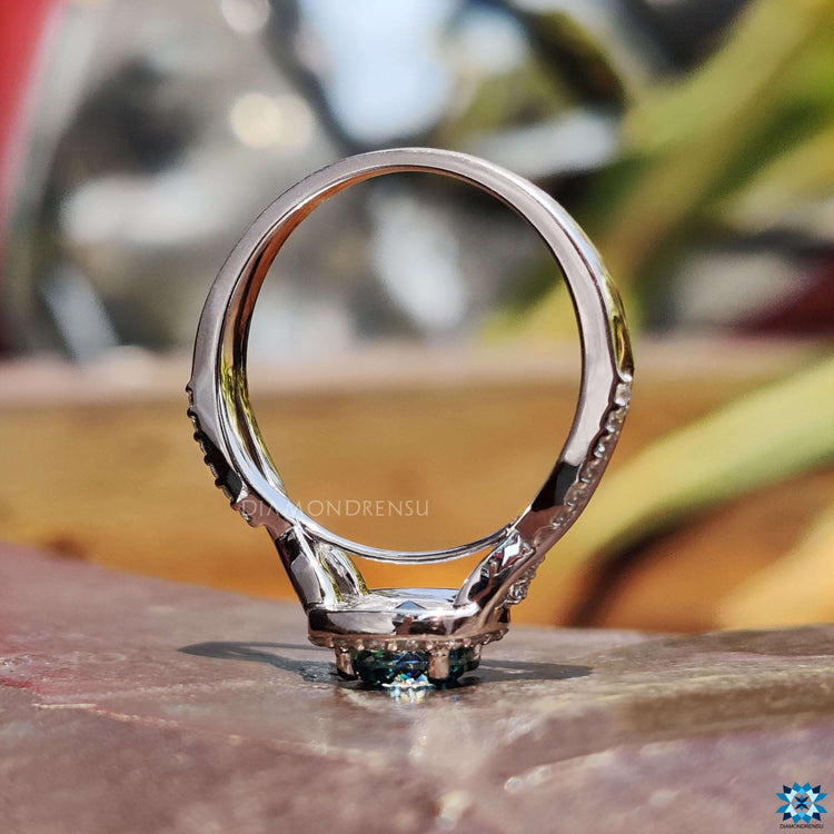 Handmade blue moissanite engagement ring.