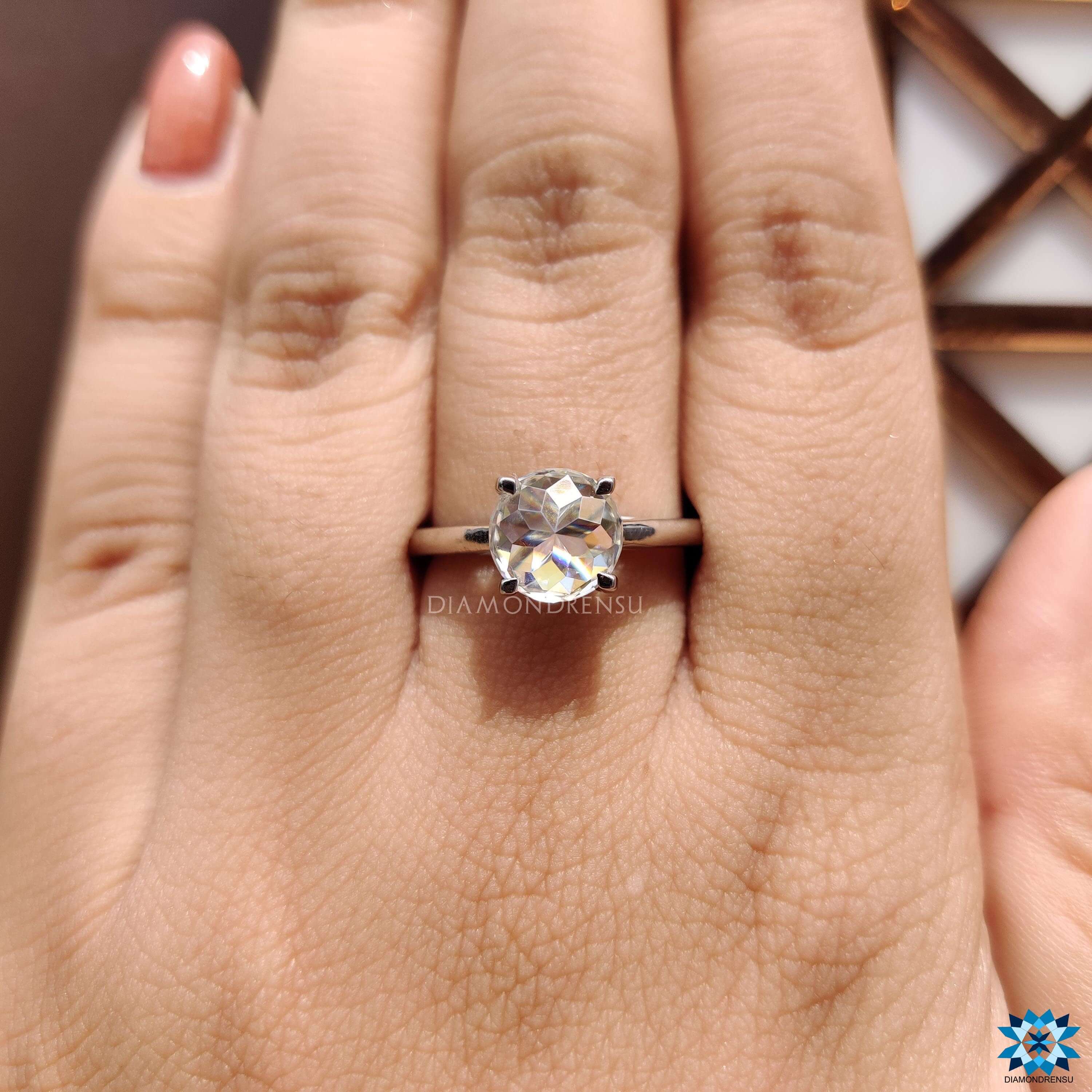 White gold moissanite solitaire with claw prong detail.
