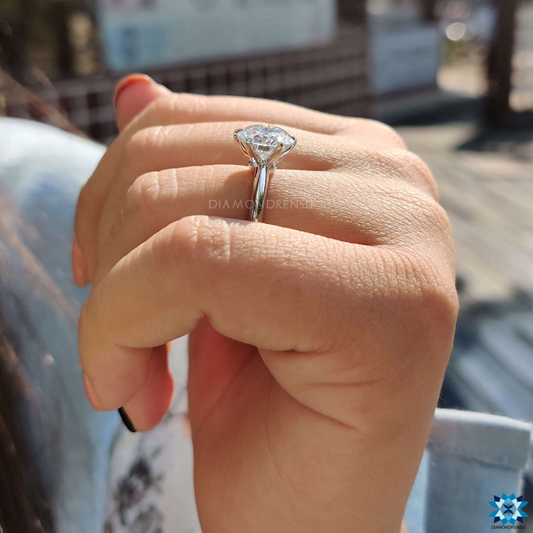 Round moissanite ring with knife edge design.